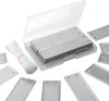 A collection of metal plant labels and a bundle of white ties, neatly arranged on a white background. Produktbild-Vorschau