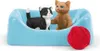 Two toy cats in a blue bed with a ball of red yarn. Podgląd zdjęcia produktu