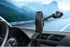 A car's dashboard with a phone mounted on a car mount, showing a road and mountains in the background. Produktbild-Vorschau