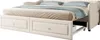 A beige daybed with two drawers and blue pillows and a blue throw blanket. Náhled obrázku produktu