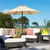 An outdoor patio scene with furniture and an umbrella. Produktbild-Vorschau