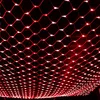 A close-up view of a red net light curtain against a black background. Náhled obrázku produktu