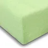 A close-up, angled view of a light green jersey fitted sheet. Produktbild-Vorschau