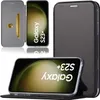A black flip case for a Samsung Galaxy S23 Plus phone is shown, with the phone displaying its screen. The case has a card slot and a stand function. Produktbild-Vorschau