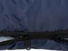 A close-up view of the zippers on a dark blue sleeping bag. Produktbild-Vorschau