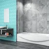 A modern bathroom with a bathtub, shower screen, sink, and vanity. Produktbild-Vorschau