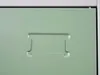A close-up view of a green metal locker with an embossed label holder. Produktbild-Vorschau