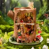 A miniature fairytale treehouse model set in a whimsical forest scene. Podgląd zdjęcia produktu