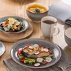 A table setting with a meal and drinks. Produktbild-Vorschau