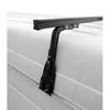 A close-up of a black roof rack foot attached to the side of a white vehicle. Podgląd zdjęcia produktu