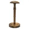 A wooden hat stand with a round base and a mushroom-shaped top, presented on a white background. Produktbild-Vorschau