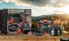 A camping cookware set is displayed on a wooden surface with a scenic mountain landscape in the background. Náhled obrázku produktu
