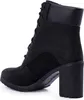 A black Timberland boot with a high heel is shown from the side against a white background. Podgląd zdjęcia produktu