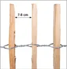 Three wooden stakes are shown with wire fencing connecting them. A measurement of 7-8 cm is indicated between two of the stakes. Produktbild-Vorschau