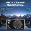 A digital camera is shown in front of a starry night sky with mountains. Produktbild-Vorschau