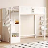 A white wooden loft bed with stairs and storage shelves, set against a light beige wall. Náhled obrázku produktu