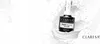 A bottle of Claresa Top Milky No Wipe nail polish is shown in a splash of white liquid, likely milk or cream, against a white background. The product is the main focus, with the brand logo and product name clearly visible. Náhled obrázku produktu
