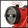 Close-up of a red and black paint sprayer nozzle with adjustment dial and arrows indicating movement. Produktbild-Vorschau