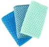 Three textured cloths in varying shades of blue and green are arranged diagonally on a white background. Produktbild-Vorschau