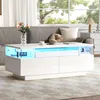 A modern living room with a white coffee table with LED lighting. Podgląd zdjęcia produktu