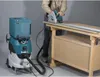 A person is using a circular saw on a workbench, with a vacuum cleaner attached. Podgląd zdjęcia produktu