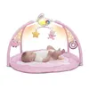 A baby lying on a pink play mat with a pink arch overhead featuring toys and lights. Náhled obrázku produktu