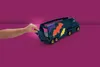 A child's hand is opening the back of a toy truck. Anteprima dell’immagine prodotto