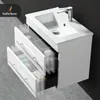 A white bathroom vanity with a sink and faucet, showing two open drawers with toiletries inside. Produktbild-Vorschau
