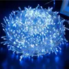 A coiled bundle of blue LED string lights on a dark background. Produktbild-Vorschau