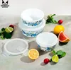 Food storage containers arranged with fruits and vegetables. Produktbild-Vorschau