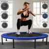 A woman is exercising on a blue trampoline, with various sizes of trampolines shown as options on the left and right sides of the image. Podgląd zdjęcia produktu