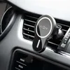 A car phone holder attached to an air vent in a car's dashboard. Náhled obrázku produktu