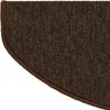 A close-up view of a brown, semi-circular carpet stair tread with a darker brown binding along the curved edge. Anteprima dell’immagine prodotto