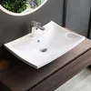 A white ceramic sink with a chrome faucet is shown on a dark wood vanity. Produktbild-Vorschau