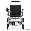 An electric wheelchair is shown from the front on a white background. Náhľad obrázku produktu
