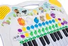 A close-up, slightly angled shot of a children's toy keyboard with animal figures on top. Anteprima dell’immagine prodotto
