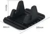 A black silicone phone holder with dimensions indicated. Voir les images du produit