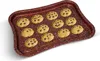 A baking tray filled with chocolate chip cookies on a white background. Podgląd zdjęcia produktu