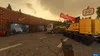 A scene from the video game Teardown, showing a construction site with vehicles and buildings. Produktbild-Vorschau