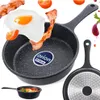 A frying pan with food items like an egg, bacon, and tomatoes, along with a smaller view of the pan with food inside. Anteprima dell’immagine prodotto
