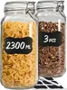 Two glass jars filled with food items, one with pasta and the other with granola, are displayed side-by-side. Labels are attached to the jars, and a marker and additional labels are placed in front of them. Podgląd zdjęcia produktu