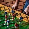 A close-up shot of a foosball table with players in action. Podgląd zdjęcia produktu