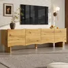 A modern living room with a TV stand, TV, and wall decor. Produktbild-Vorschau