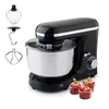 A black kitchen mixer with accessories and cupcakes. Produktbild-Vorschau