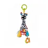 A baby toy in the shape of a zebra hanging from a green ring. Podgląd zdjęcia produktu