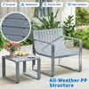 An outdoor patio set with a chair and a small table, featuring plants in the background. Podgląd zdjęcia produktu