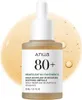 A bottle of Anua Heartleaf 80+ Moisture Soothing Ampoule with a dropper, set against a blurred yellow background with bubbles. Náhľad obrázku produktu