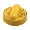 A yellow cap with text and symbols on a white background. Náhled obrázku produktu