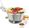 An electric grill with grilled vegetables and meat, served with dipping sauces and bread. Produktbild-Vorschau