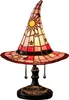 A witch hat-shaped stained glass table lamp with sun and star motifs, displayed on a white background. Produktbild-Vorschau